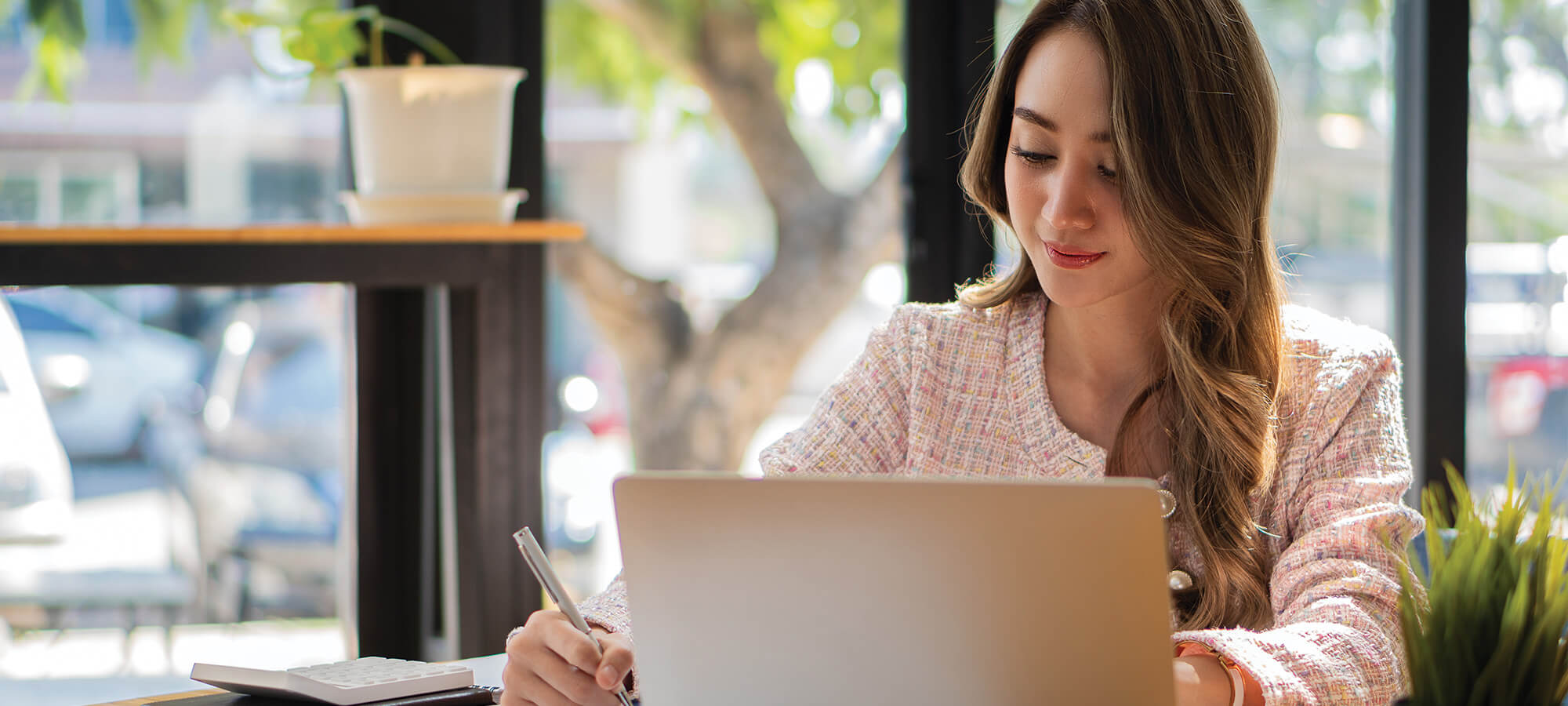 business woman sitting with pc budget cafe office