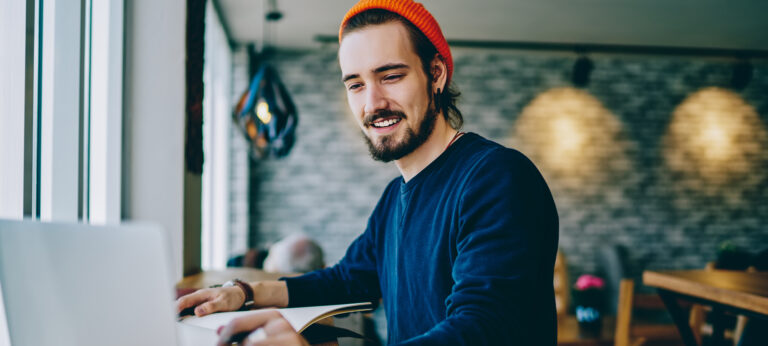 A man making a ChatGPT invoice on his laptop