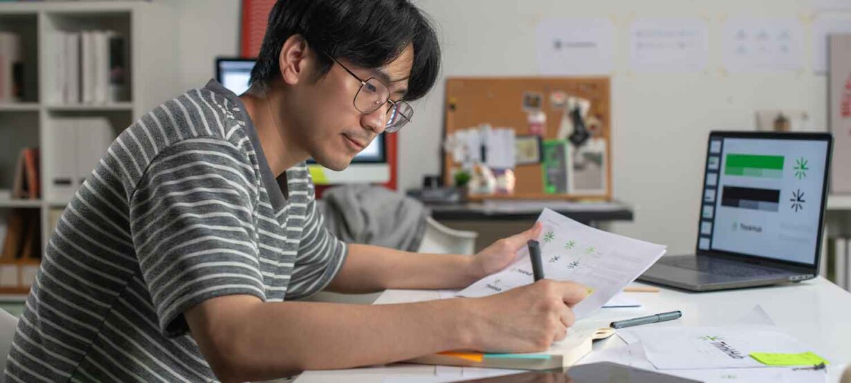 A man working on how to create a logo