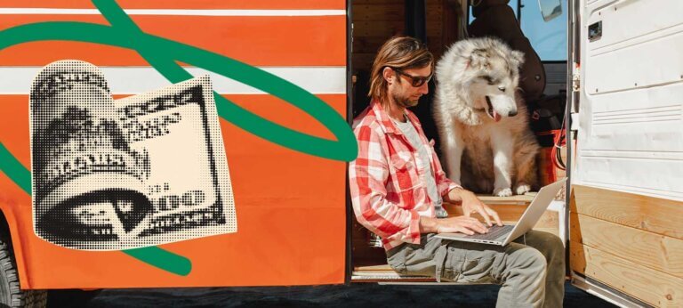 A man in a camper van working on his laptop to set a selling price while a dog looks on