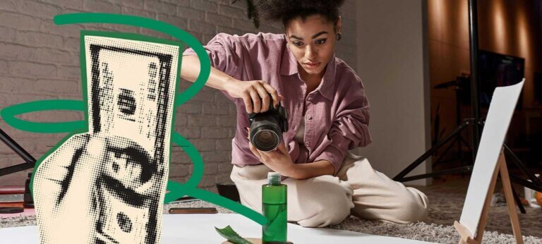 A freelance photographer taking photos in her studio