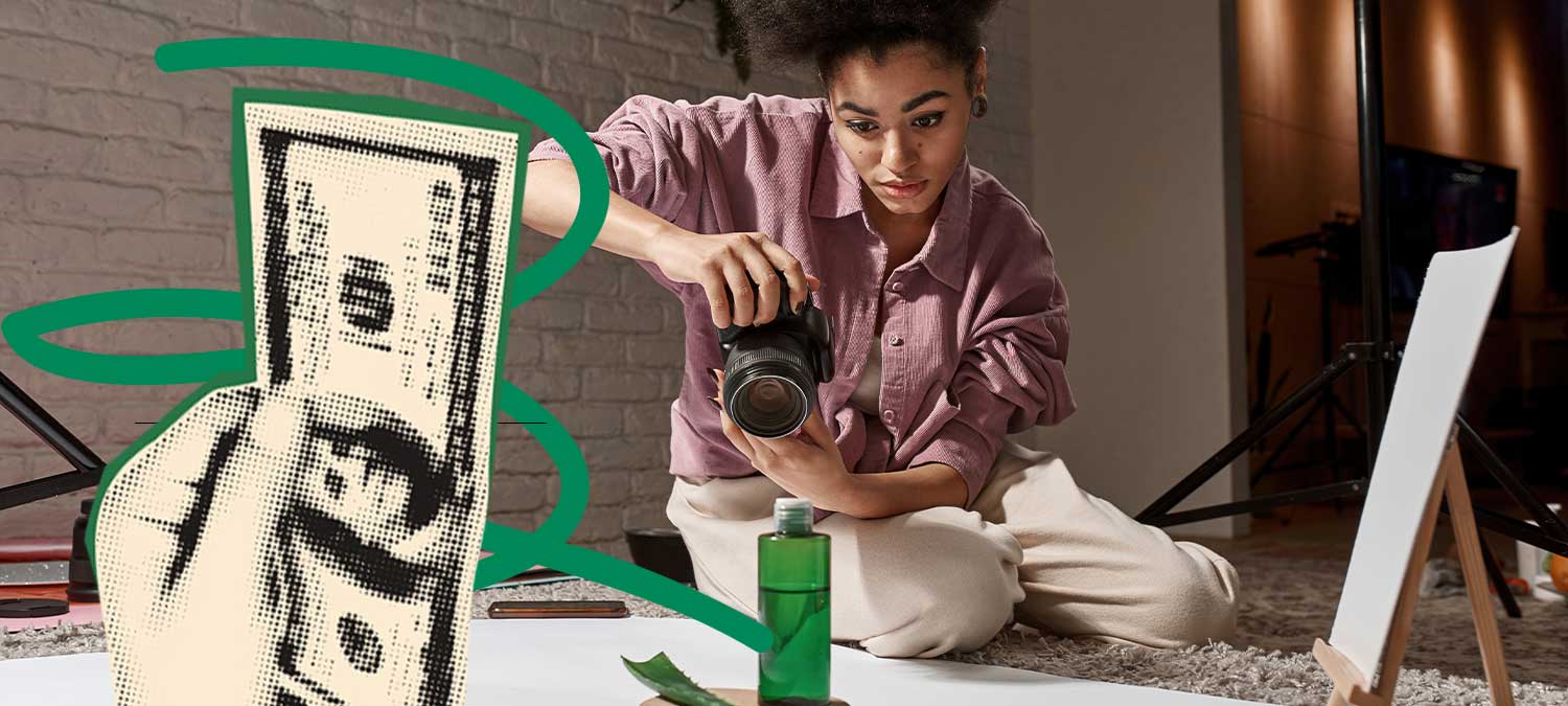 A freelance photographer taking photos in her studio