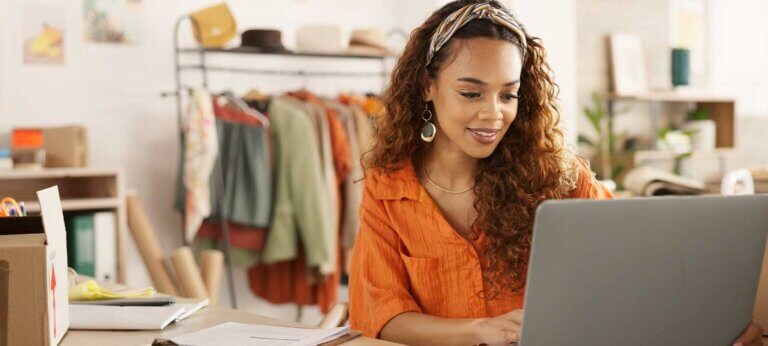 A female solopreneur working on her laptop