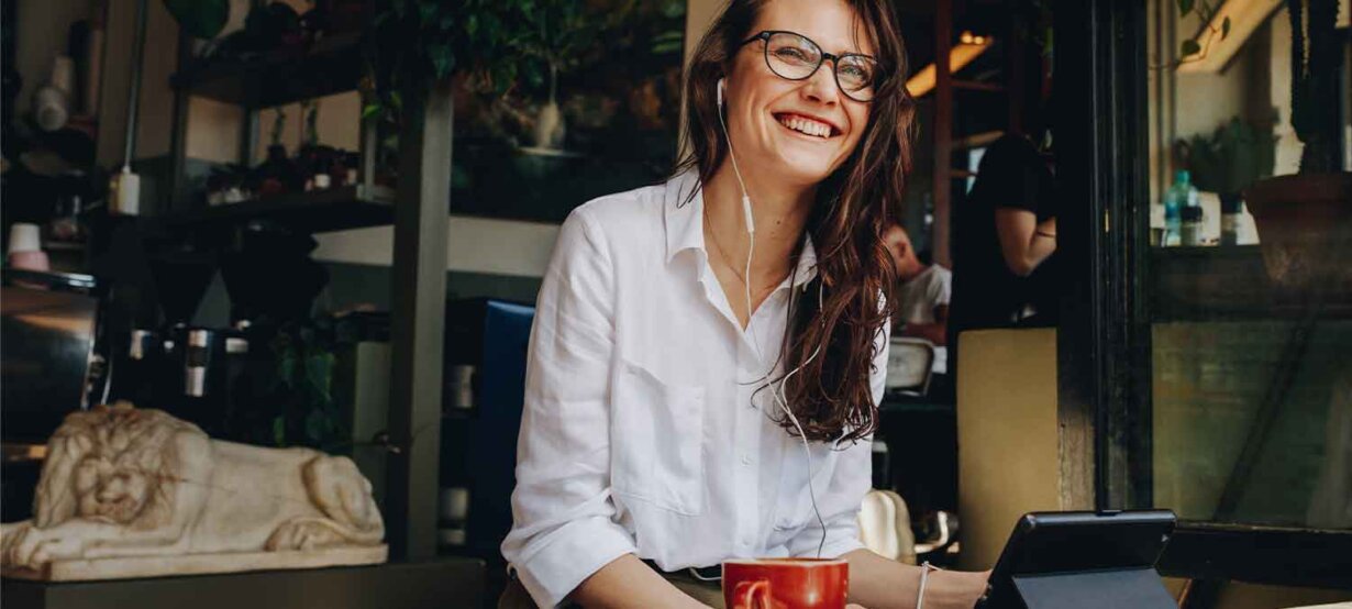 A small business owner working at a café