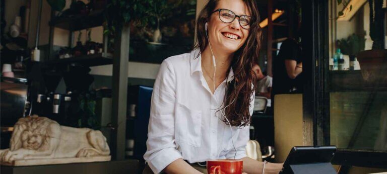 A small business owner working at a café