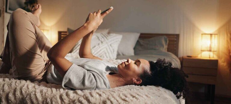 A woman making an invoice using her phone