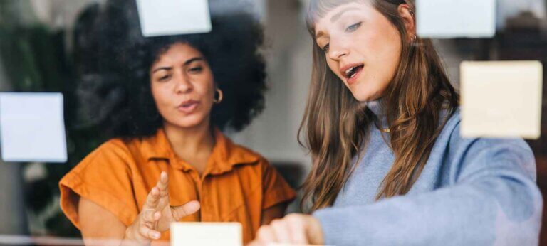 Two women having a workshop to come up with a brand identity